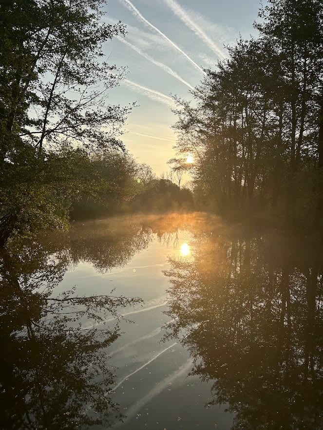 Lake at dusk with soft reflections — The Shift Retreats